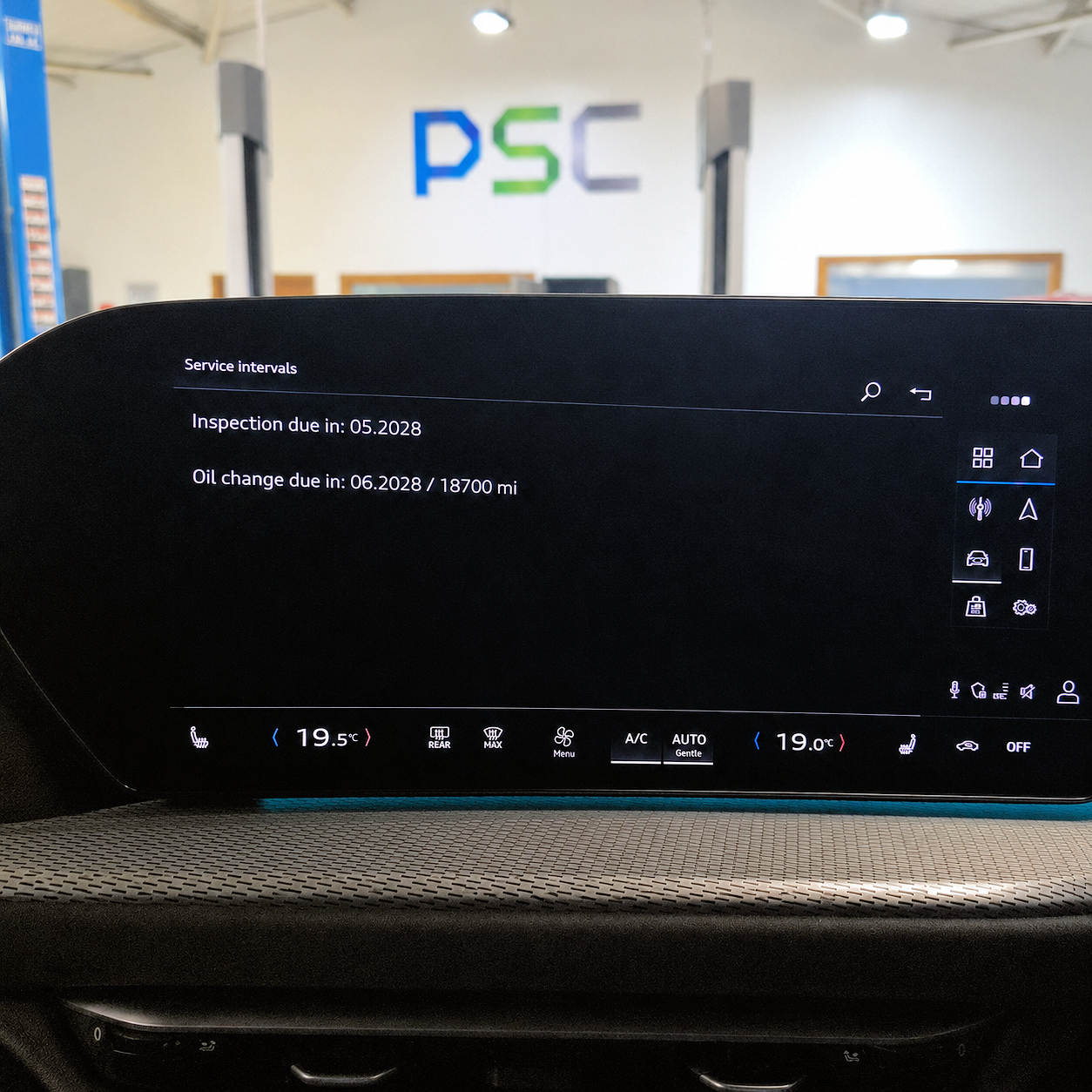 Audi infotainment screen showing updated service interval information after a dashboard reset, with the PSC logo visible in the background