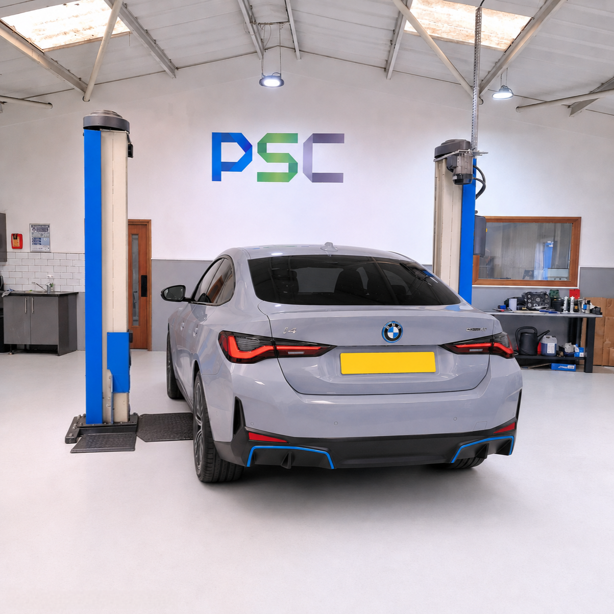 BMW i4 electric vehicle being serviced in PSC Autocentre's workshop.