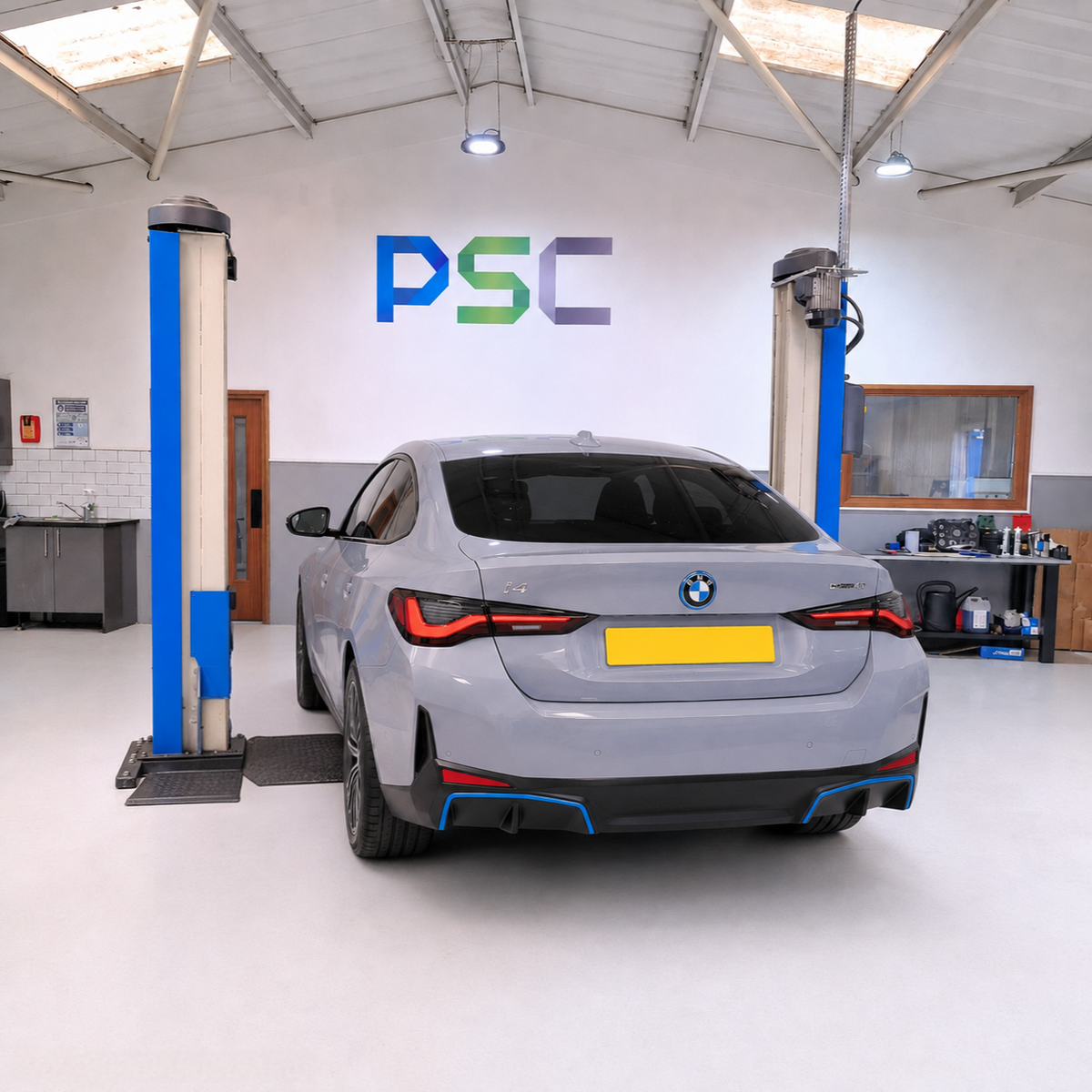 BMW i4 electric vehicle being serviced in PSC Autocentre's workshop.